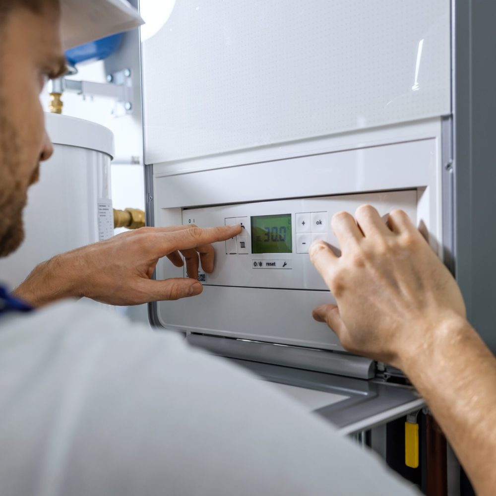 Worker,Set,Up,New,Central,Gas,Heating,Boiler,For,Home